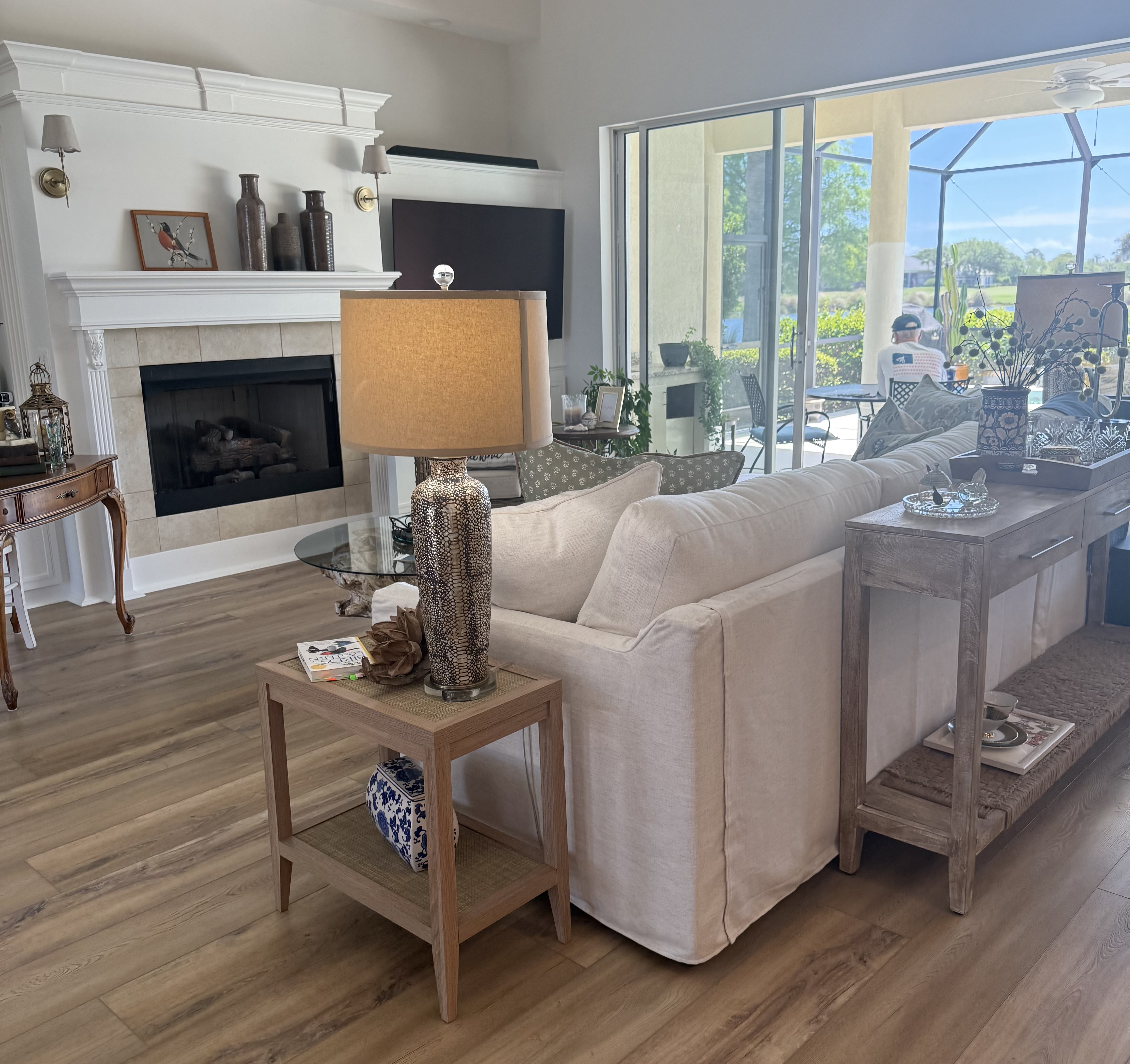 An elegant,  COASTAL HOME — A blank canvas in the living room, dining room, and breakfast room, transformed into an elegant, coastal environment.